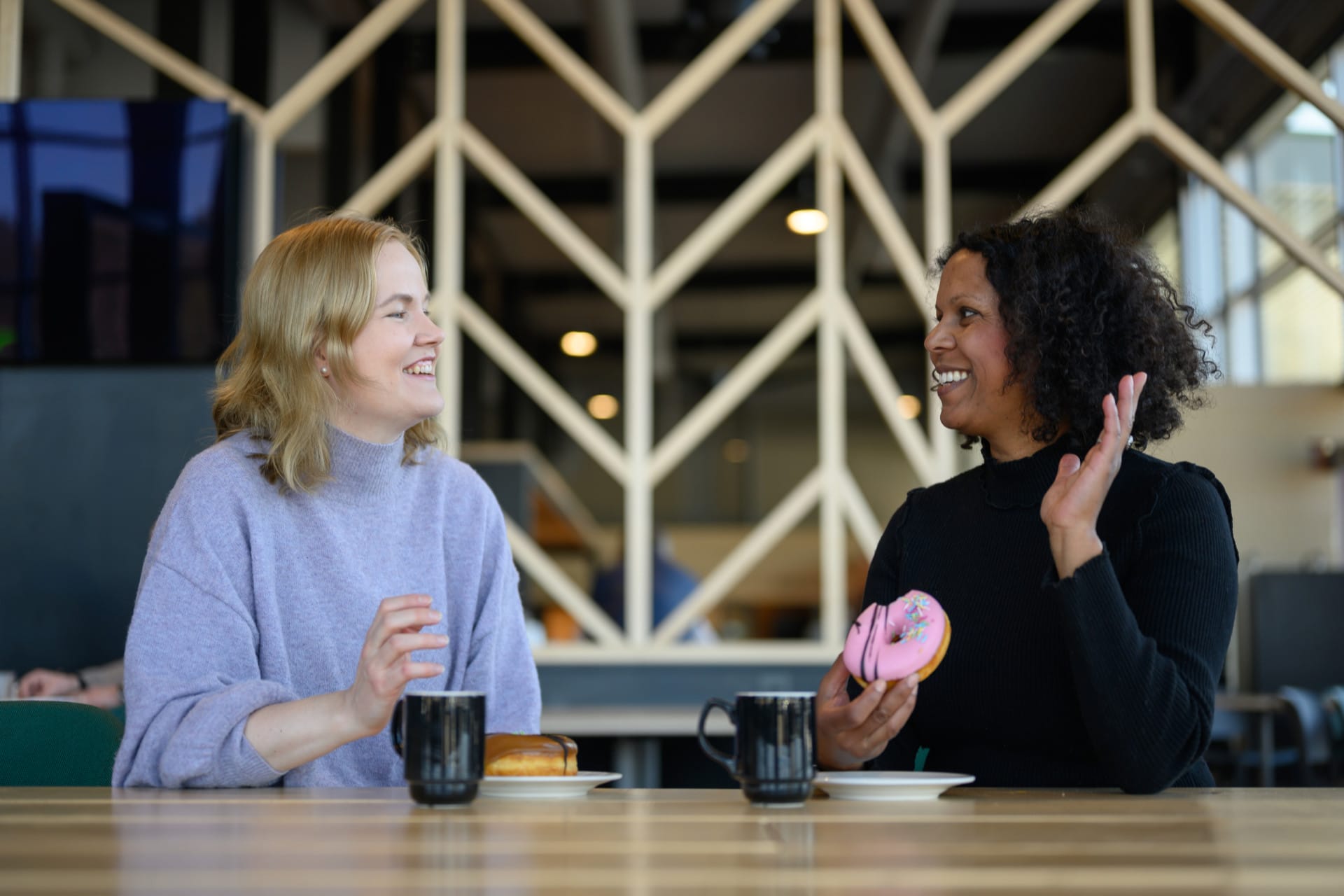 Two women at a service station having coffee